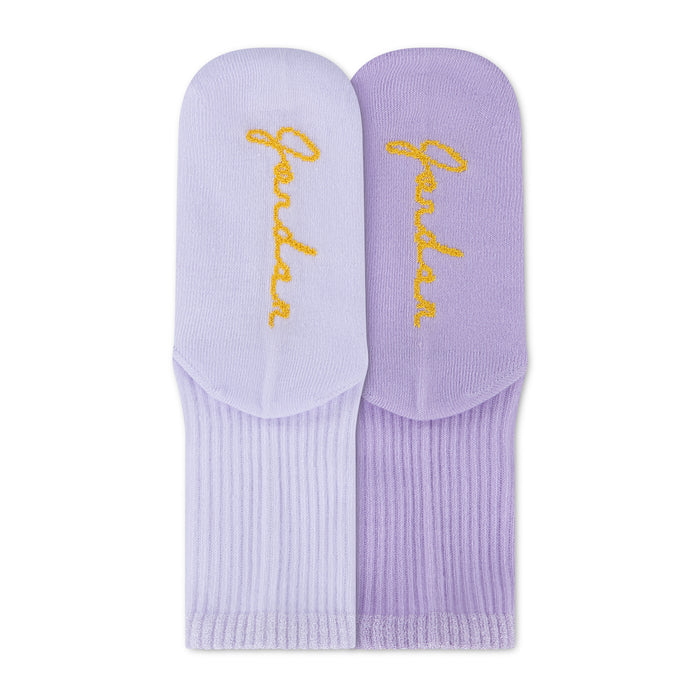 Air Jordan half crew socks close-up in light purple and lavender with yellow logo