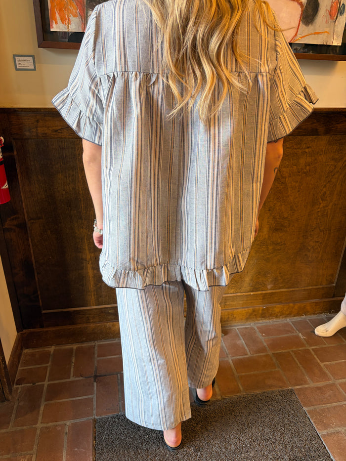 Camille & Co. Earn Your Stripes top featuring black and white striped pattern, long sleeves, and a relaxed fit.
