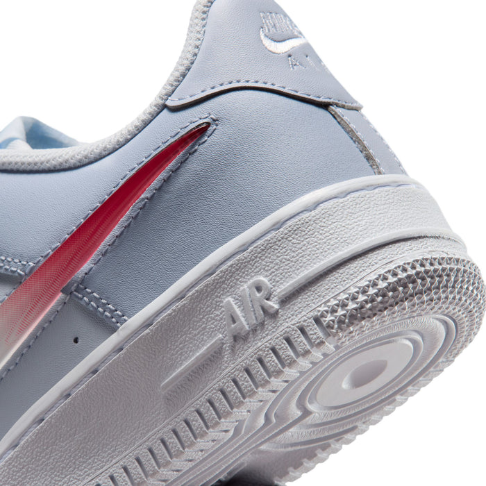 Close-up of youth sneaker side and midsole, showing red accent and 'AIR' detail