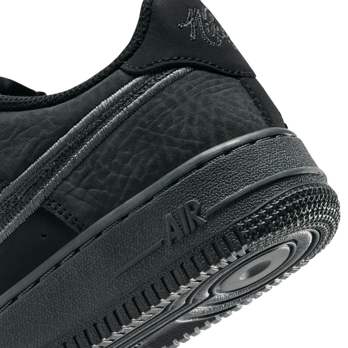 Air Force 1 LV8 youth sneakers close-up, textured midsole and AIR logo