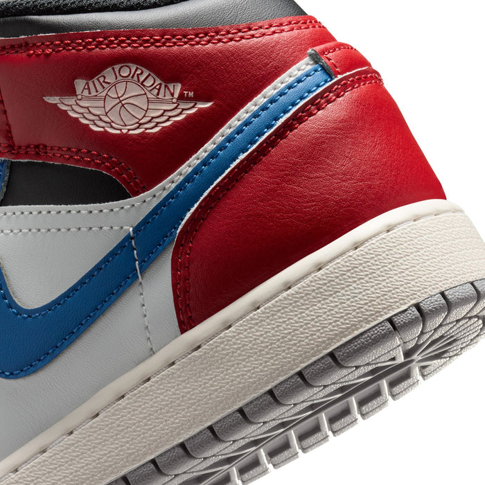Youth Air Jordan 1 Mid sneakers close-up of red heel panel with Air Jordan wing logo.