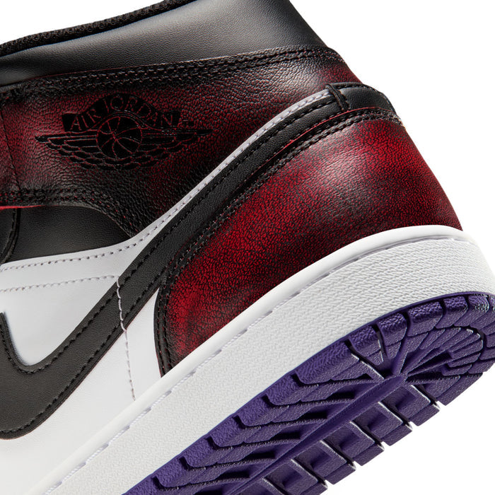 Close-up of side of mid-top sneakers: burgundy-red leather, black swoosh, purple outsole tread