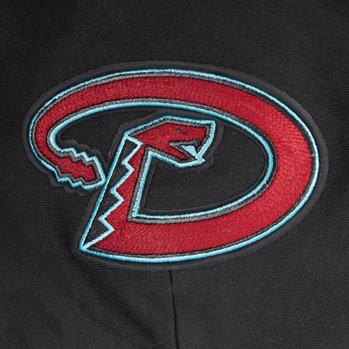 Embroidered red-and-teal D logo patch on black hoodie