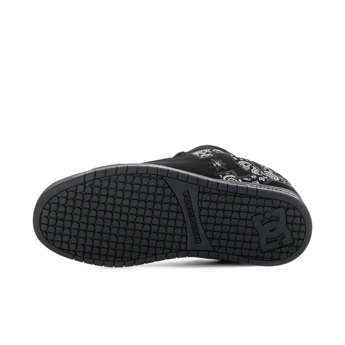 Black outsole with textured tread pattern and DC logo on heel.