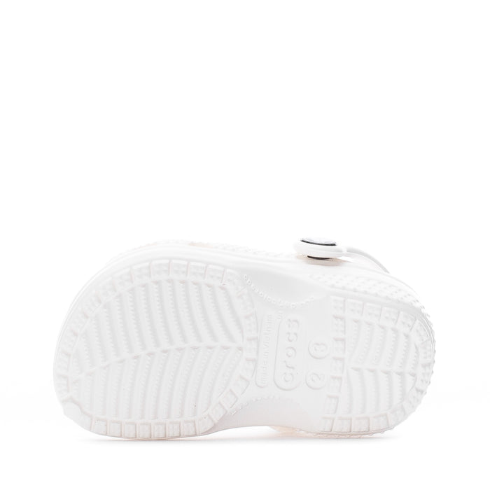 Infant white Crocs clog outsole view with textured tread and molded logo.