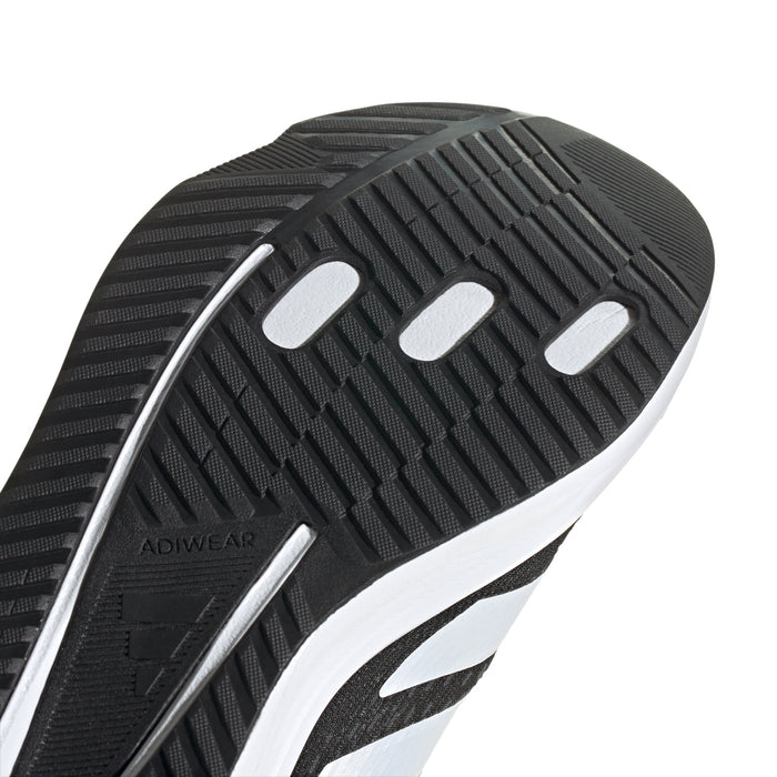 Black traction outsole with ADIWEAR zone and white midsole trim