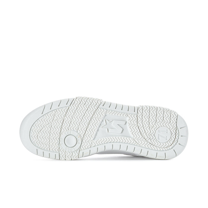 Women's white low-top sneakers, outsole view with star logo and tread pattern