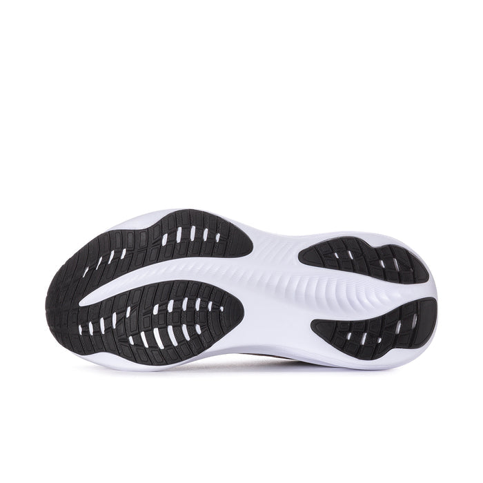 Women's navy running shoe outsole with white midsole and black tread pattern