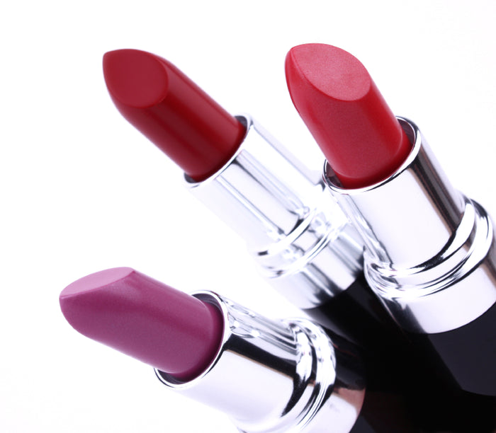 Three open lipsticks showing the colors