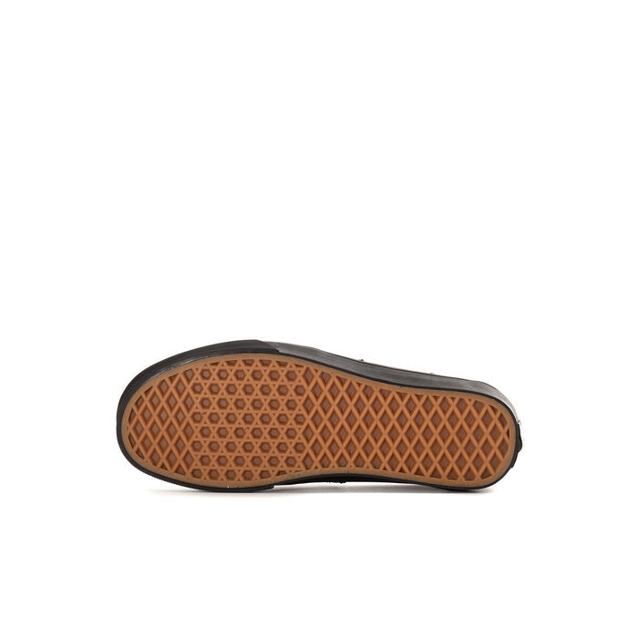 Kids' Vans loafer outsole with tan tread, black sidewall