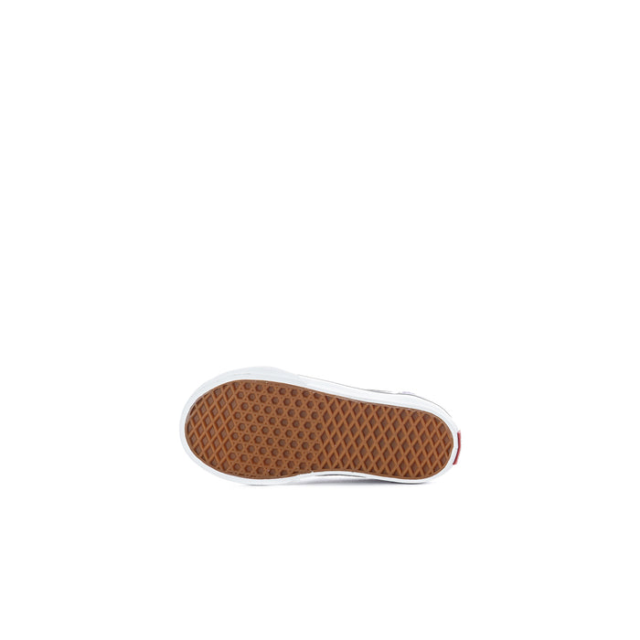 Toddler sneaker outsole view with textured gum tread and white rubber edge