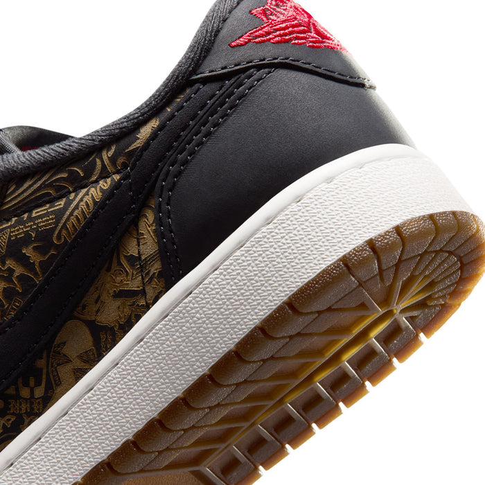 Youth low-top sneaker close-up, black upper with gold pattern, white sole, red swoosh