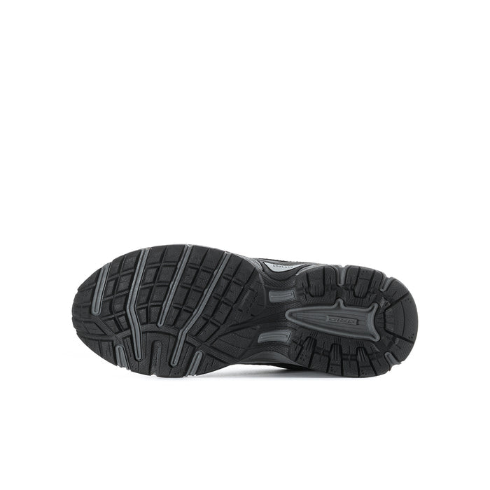 Youth black running shoe outsole with deep tread pattern