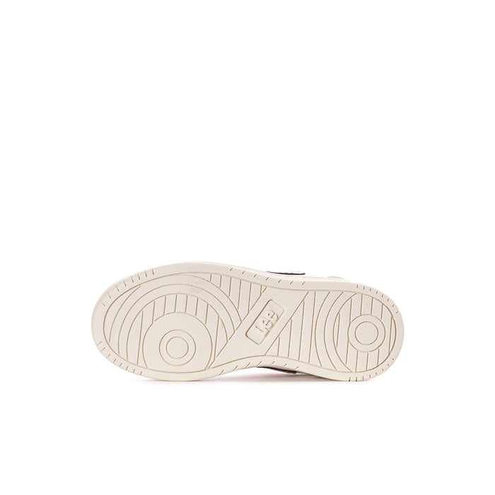 Kids sneaker outsole with textured tread and oval logo detail