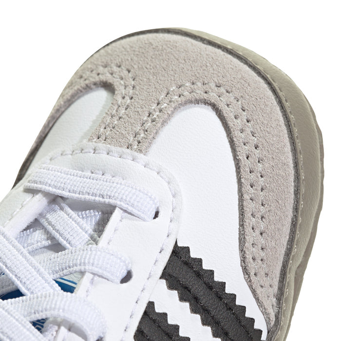 Infant adidas Samba sneakers: close-up of toe and side panel with white laces
