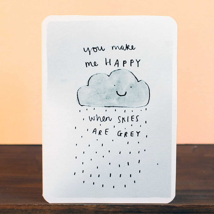 Greeting card with blue smiling cloud, grey rain, and 'you make me HAPPY' message