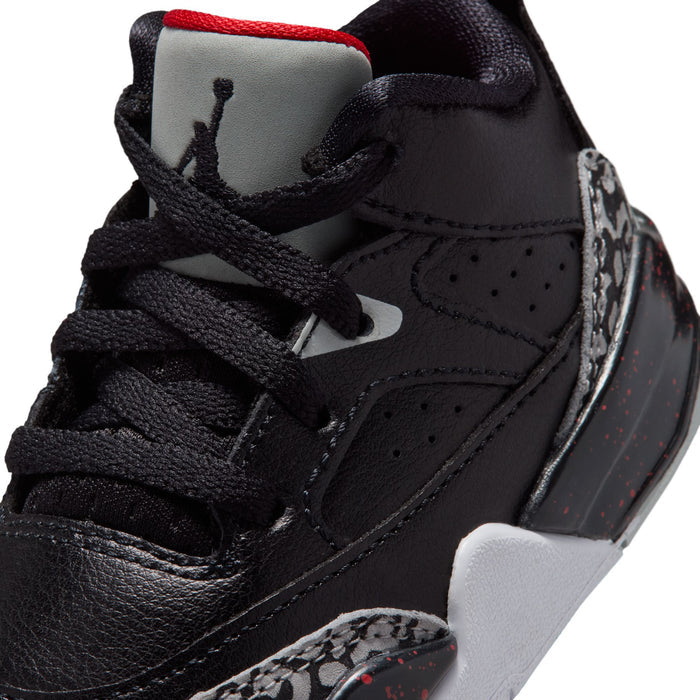 Toddler black sneaker close-up with laces, swoosh mark, and red heel lining.