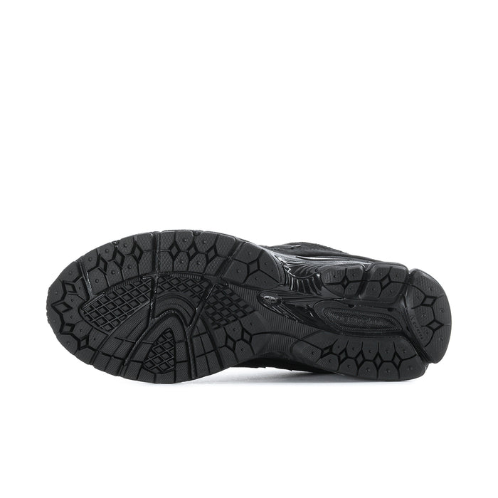 Men's black sneakers outsole tread pattern with rugged rubber traction bottom