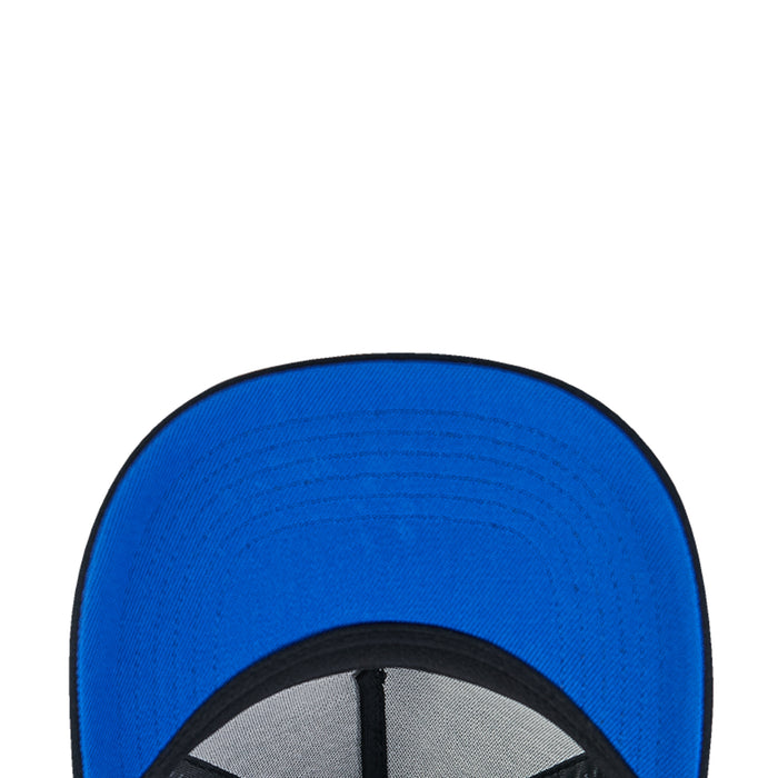 Blue inner brim panel of a black snapback cap with stitched edge