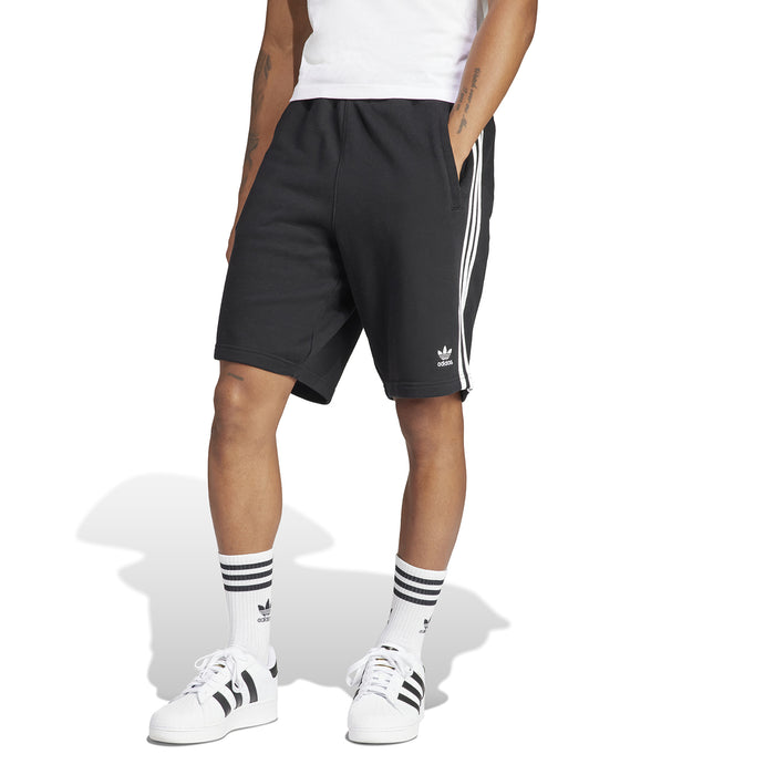 Men's black adidas 3-Stripe shorts on model, side view with white stripes