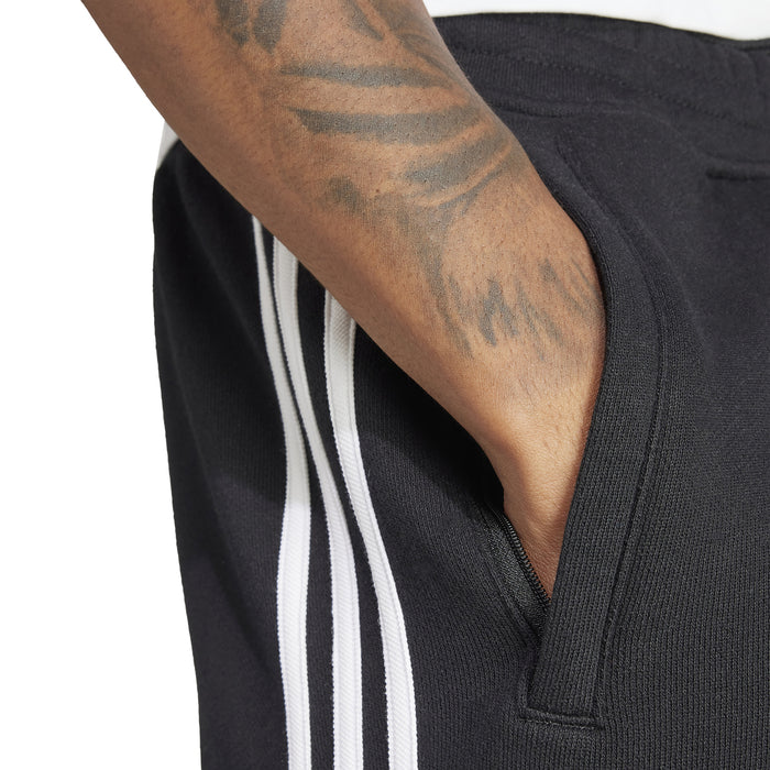 Men's black adidas 3-Stripe shorts close-up, white side stripes and pocket