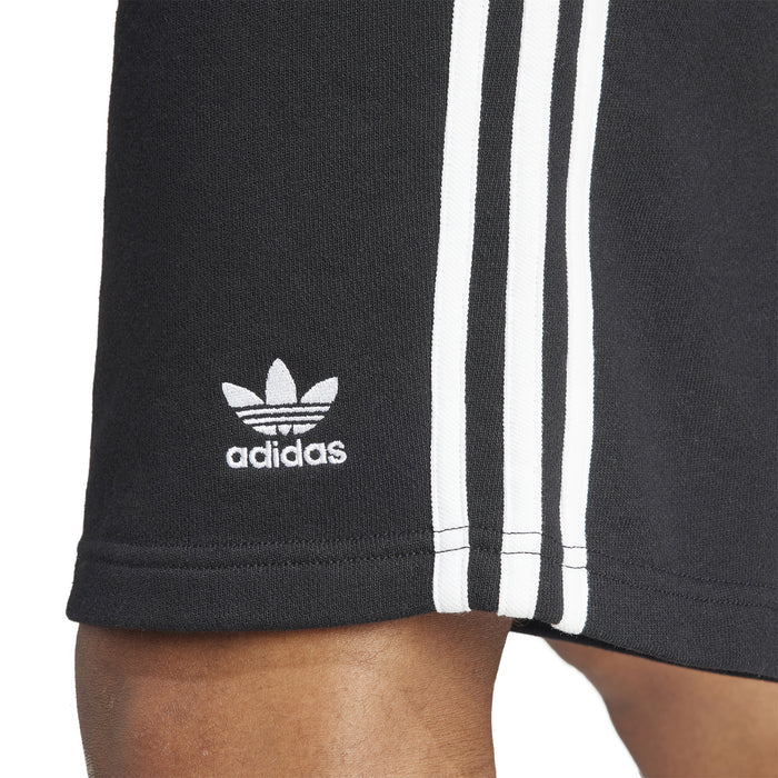 Men's black adidas 3-Stripe shorts hem close-up with adidas logo and white stripes