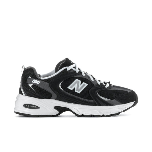 Wide women’s athletic sneakers in black with white sole and large N logo