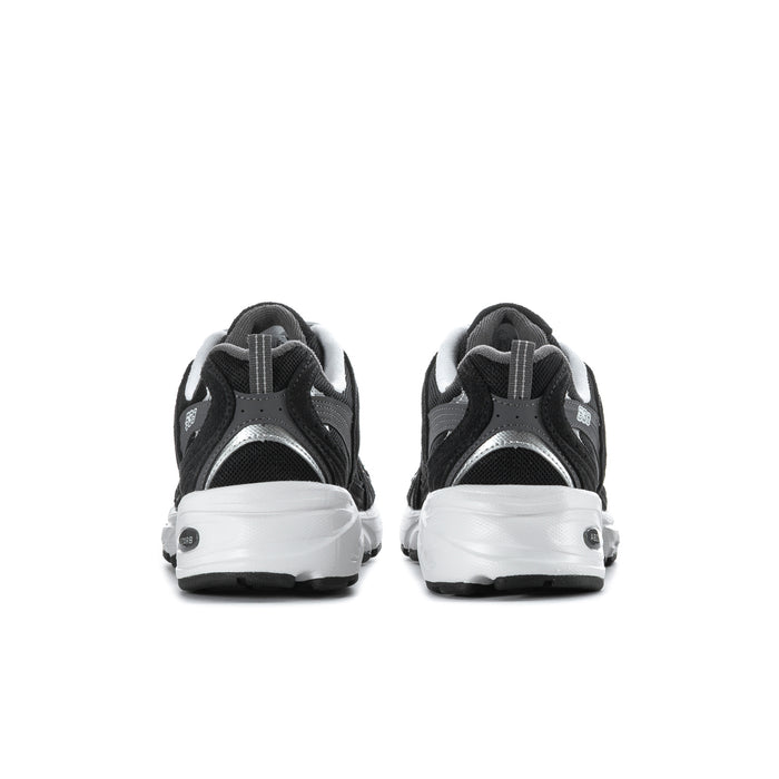 Wide women’s athletic sneakers, outsole and inner side view in black with white sole