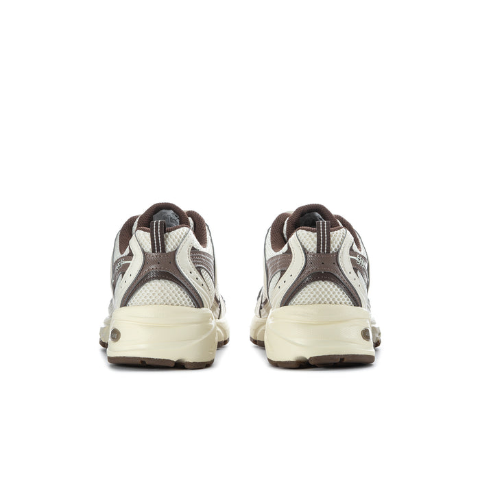 Sneaker outsoles and inner view: treaded rubber sole, cream and brown upper