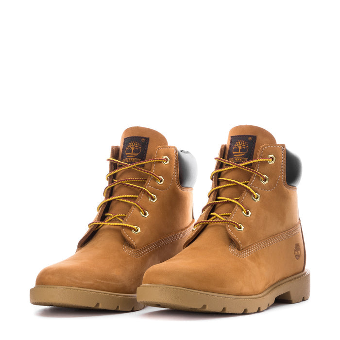 Pair of youth 6-inch wheat nubuck boots, lace-up with yellow laces, logo