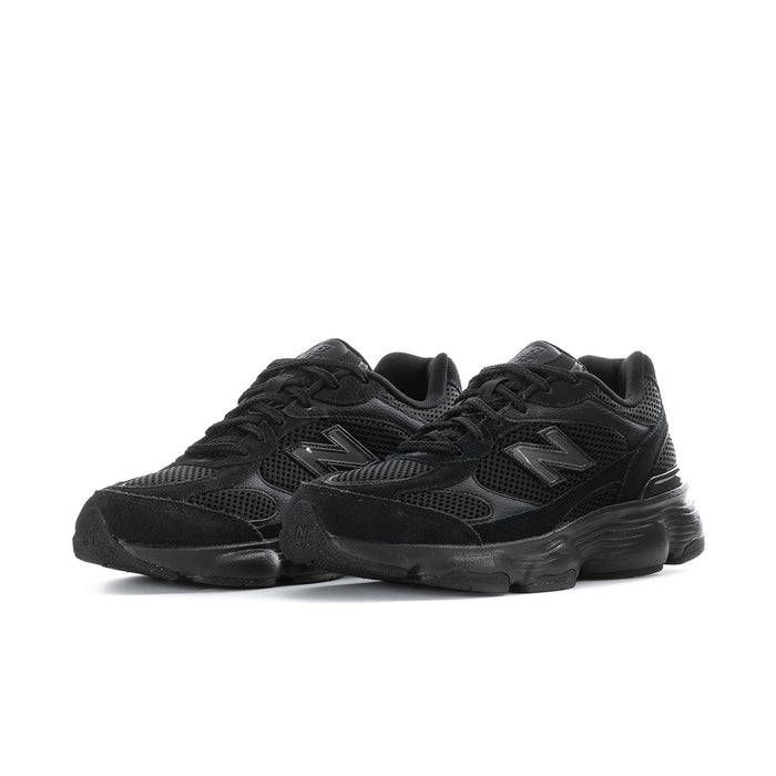 Black athletic sneakers, lace-up mesh with oversized rubber sole, side-by-side