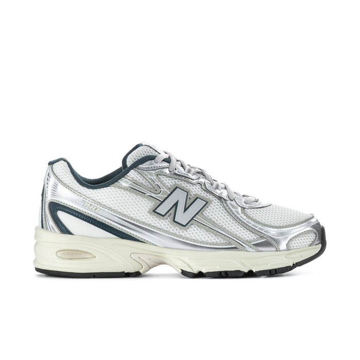 Men's athletic shoes in white metallic with teal accents, N logo and lace-up design
