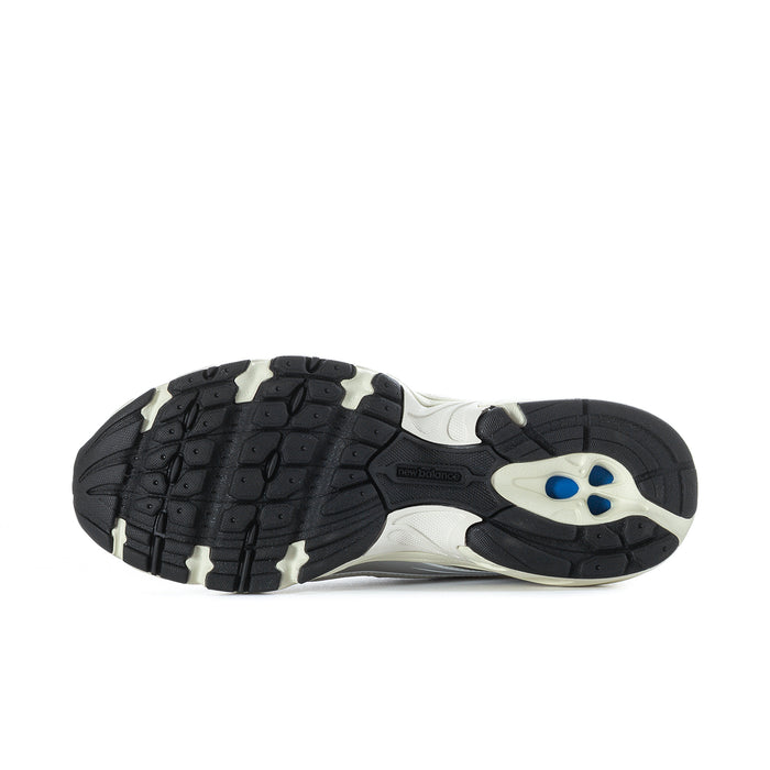 Men's athletic shoes outsole view, black tread with white midsole and heel pods