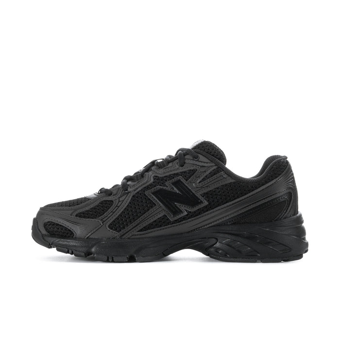 Black and dark gray sneakers, rear view with cushioned heel and lace collar