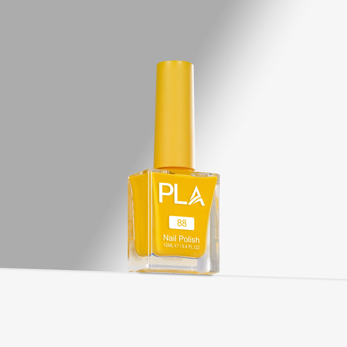 Yellow nail polish bottle with 'PLA' branding on a gray background