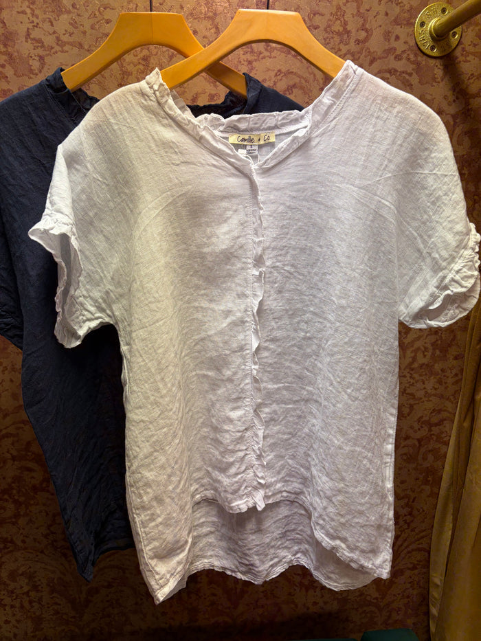 Camille & Co. ruffle linen top with feminine ruffle details, lightweight fabric, and casual chic style for warm-weather wear.