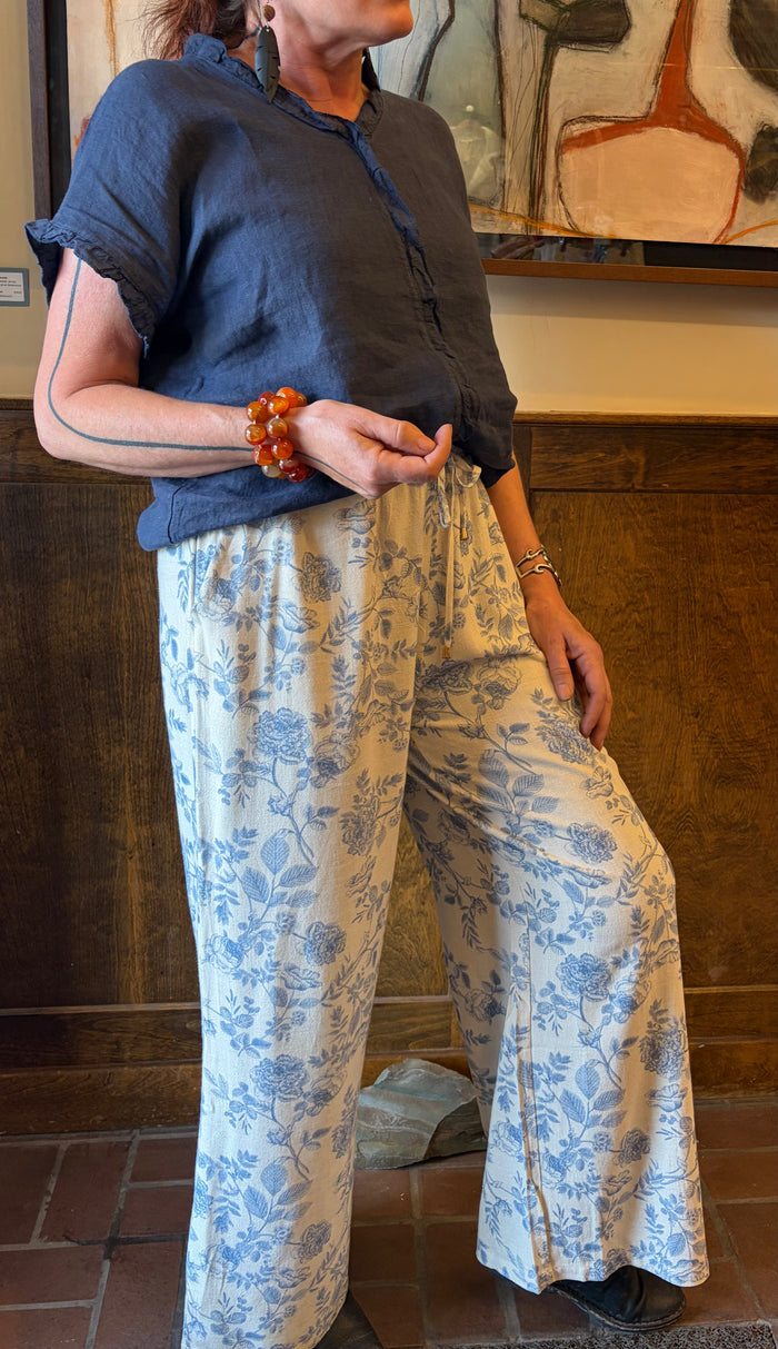 Camille & Co. ruffle linen top, lightweight sleeveless blouse with ruffle details, white fabric, casual summer fashion.