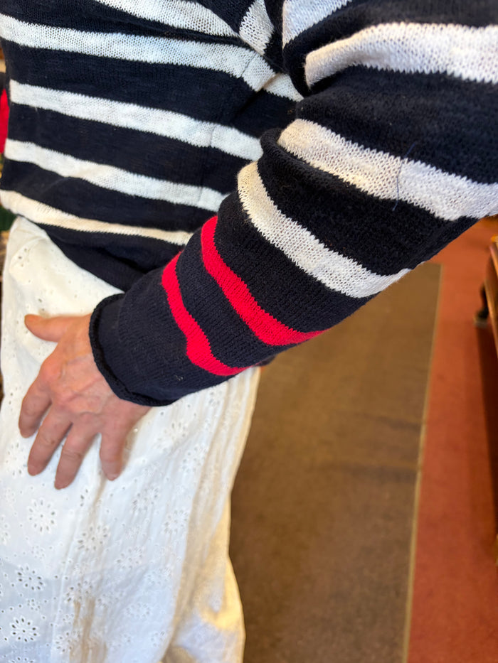 Cream-colored Sail On sweater by Camille & Co. featuring a cozy knit texture and relaxed fit, displayed flat on a white background.