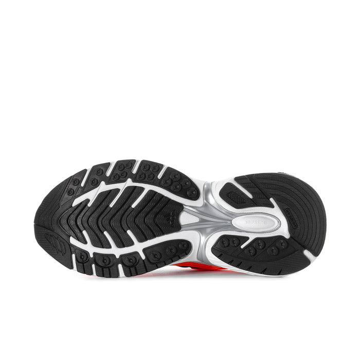 Men's running shoe outsole with black traction tread and silver-gray midsole