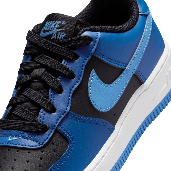 Nike Air Force 1 upper close-up: blue leather, black laces, light-blue Swoosh