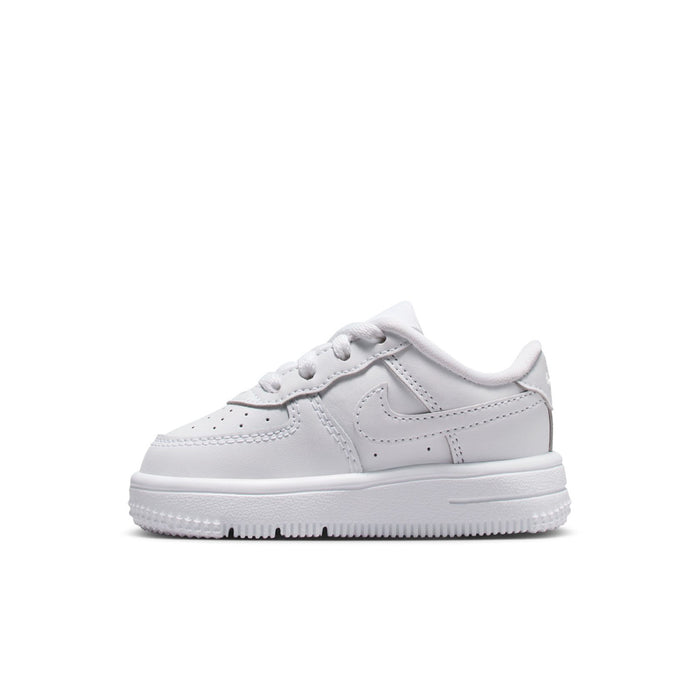 Toddler white low-top sneakers, front angle with swoosh and lace-up