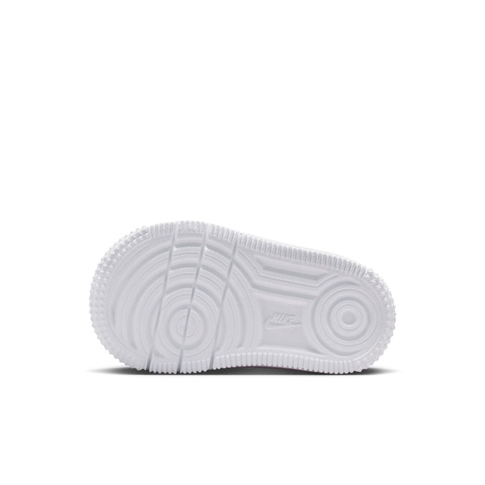 Toddler white sneaker outsole with textured tread and circular grip pattern