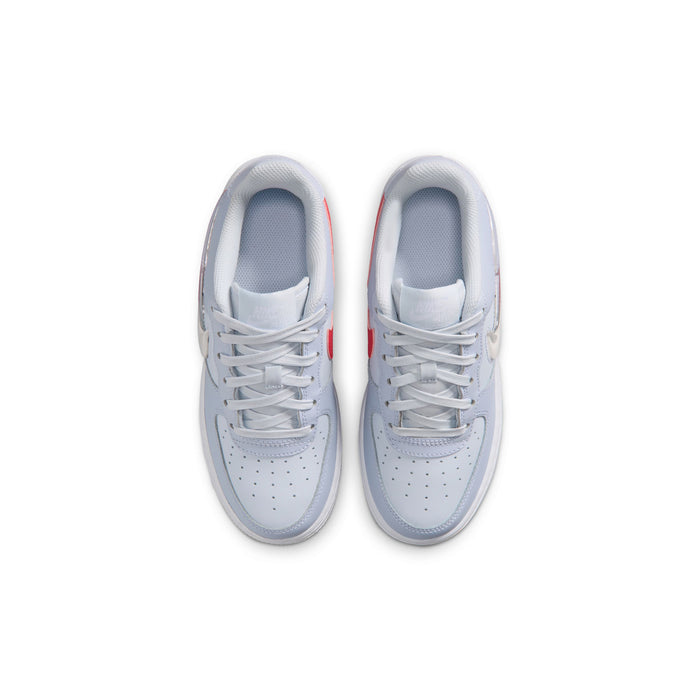 Pair of youth light blue-gray low-top sneakers with white laces and perforated toe