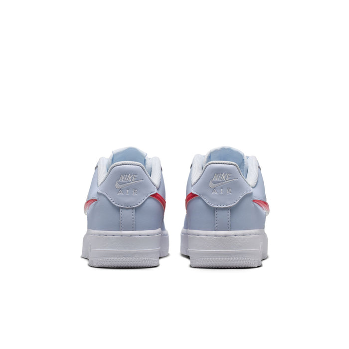Youth low-top sneakers heel view in light blue-gray with red heel accents