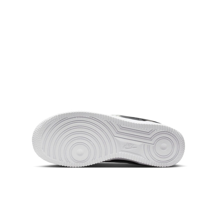 Youth low-top sneaker outsole with textured tread and white rubber bottom