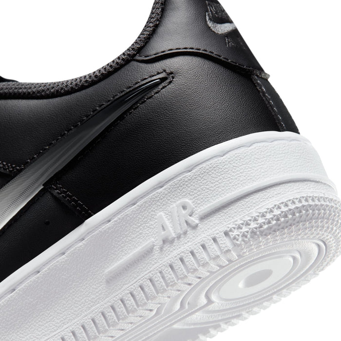 Close-up of youth low-top sneaker midsole with Air branding on white outsole
