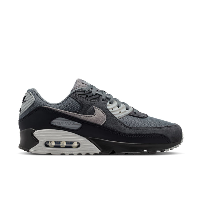Men's Nike Air Max 90 sneaker in smoke gray/black, side view with swoosh and air sole