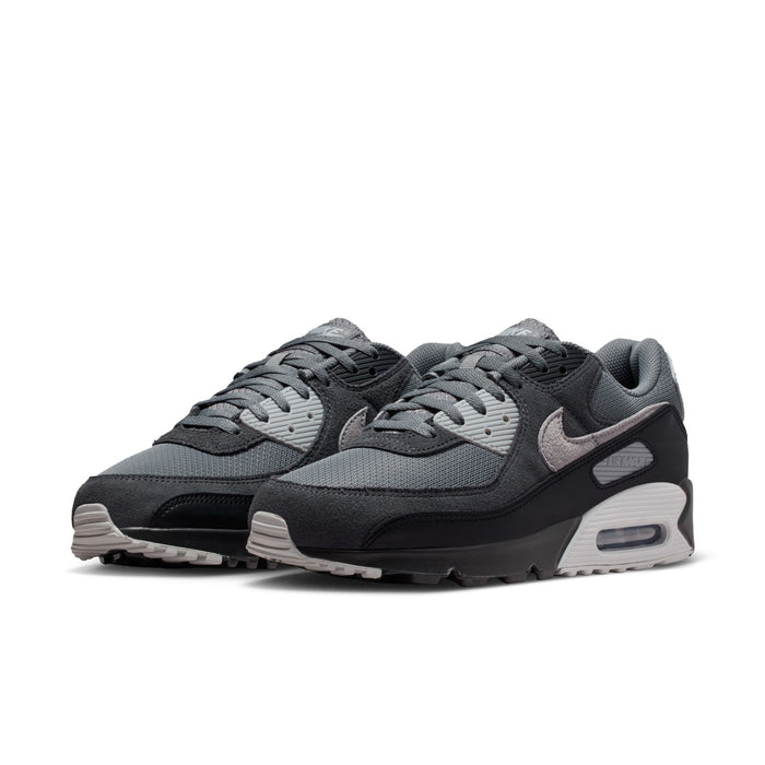 Men's Nike Air Max 90 sneakers pair, lace-up front three-quarter view, air-cushion sole