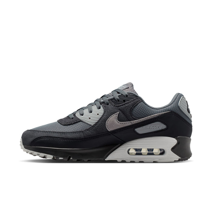 Men's Nike Air Max 90 sneaker, angled side view with gray suede overlays and air window