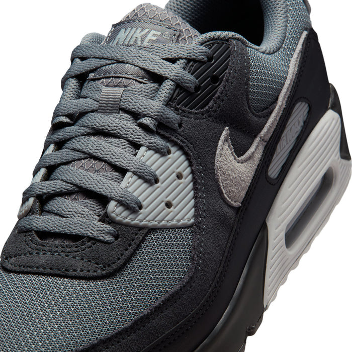 Men's Nike Air Max 90 close-up, textured mesh upper with dark swoosh and laces